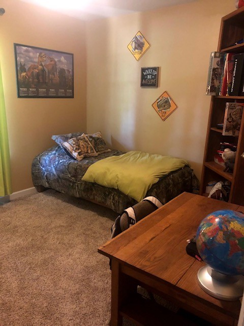 7532 Cherokee Hills Road Fairview, TN 37062 - Photo 12 of 14 a bedroom with bed and baby crib
