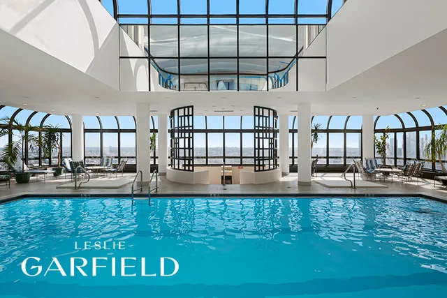 a view of swimming pool with outdoor seating