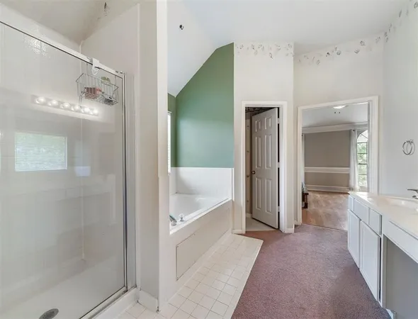 a bathroom with a bathtub and a shower