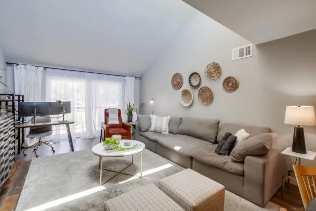 a living room with furniture and a table