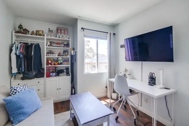 a view of a workspace with furniture and toys