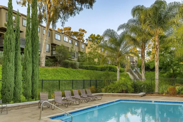 a view of a swimming pool with a patio