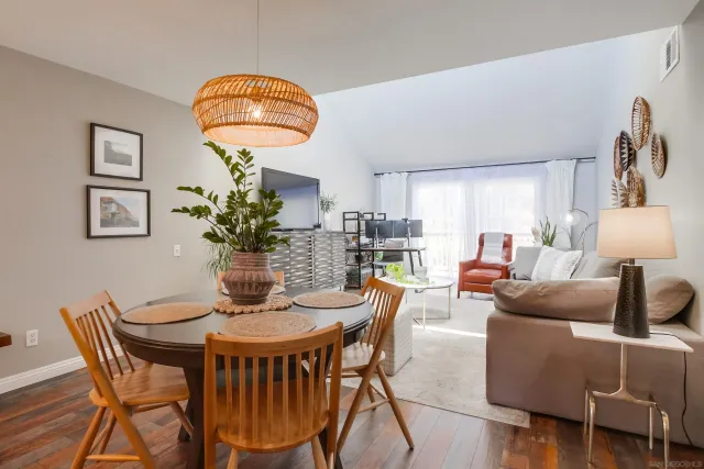 a dining room with furniture and window
