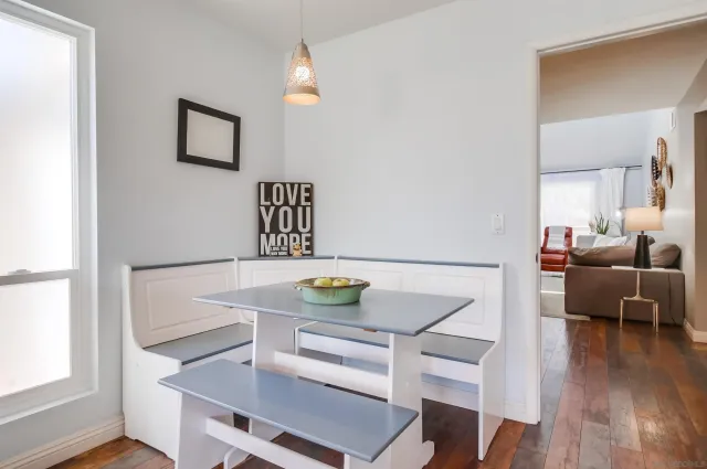 a view of a dining room with furniture and wooden floor