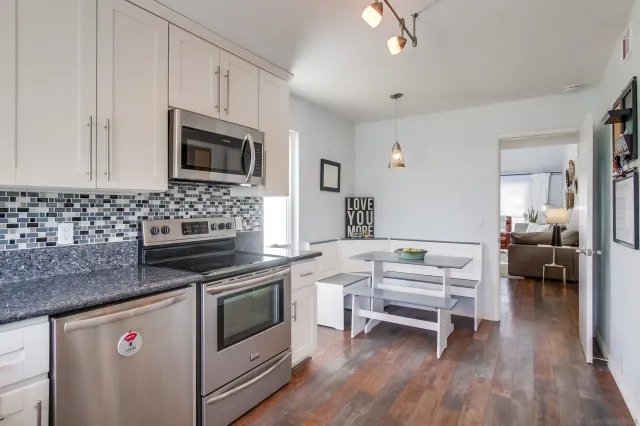 a kitchen with a stove and a microwave
