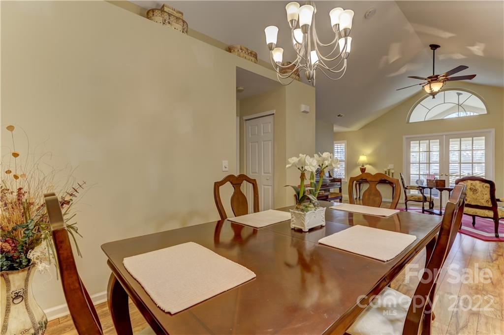 728 Ledgestone Court Tega Cay, SC 29708 - Photo 11 of 30 a view of a dining room with furniture and a chandelier