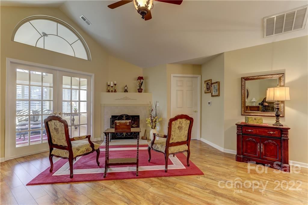 728 Ledgestone Court Tega Cay, SC 29708 - Photo 12 of 30 a living room with furniture a rug and a fireplace