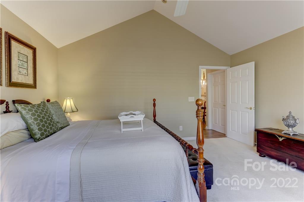 728 Ledgestone Court Tega Cay, SC 29708 - Photo 17 of 30 a bedroom with a bed and a lamp