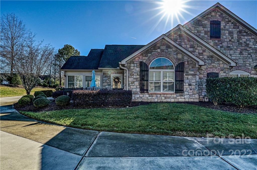 728 Ledgestone Court Tega Cay, SC 29708 - Photo 2 of 30 a front view of a house with a garden