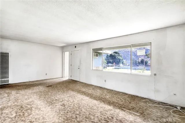 an empty room with window