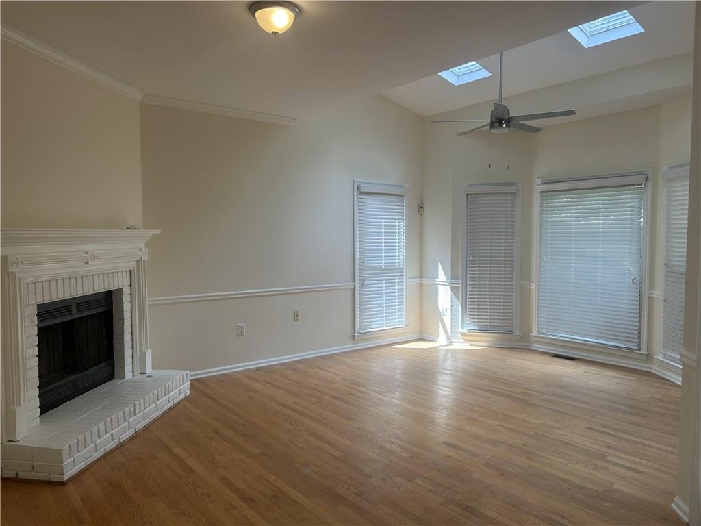 1273 Channel Park Southwest Marietta, GA 30064 - Photo 23 of 69 an empty room with wooden floor fireplace and windows