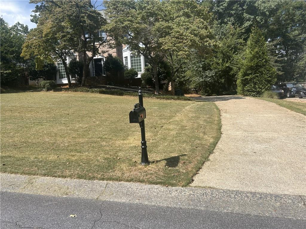 1273 Channel Park Southwest Marietta, GA 30064 - Photo 3 of 69 a front view of a house with a yard