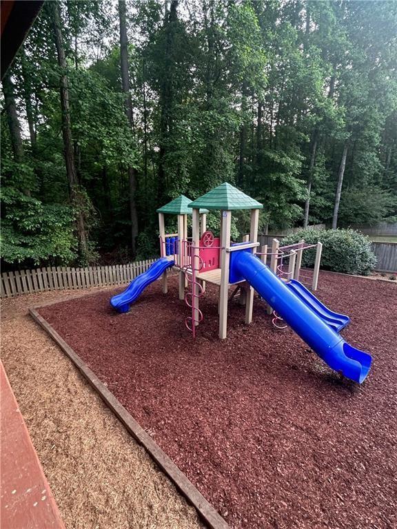 1273 Channel Park Southwest Marietta, GA 30064 - Photo 64 of 69 a view of a wooden deck with chairs and a yard