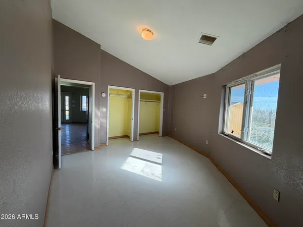 a view of an empty room with a window