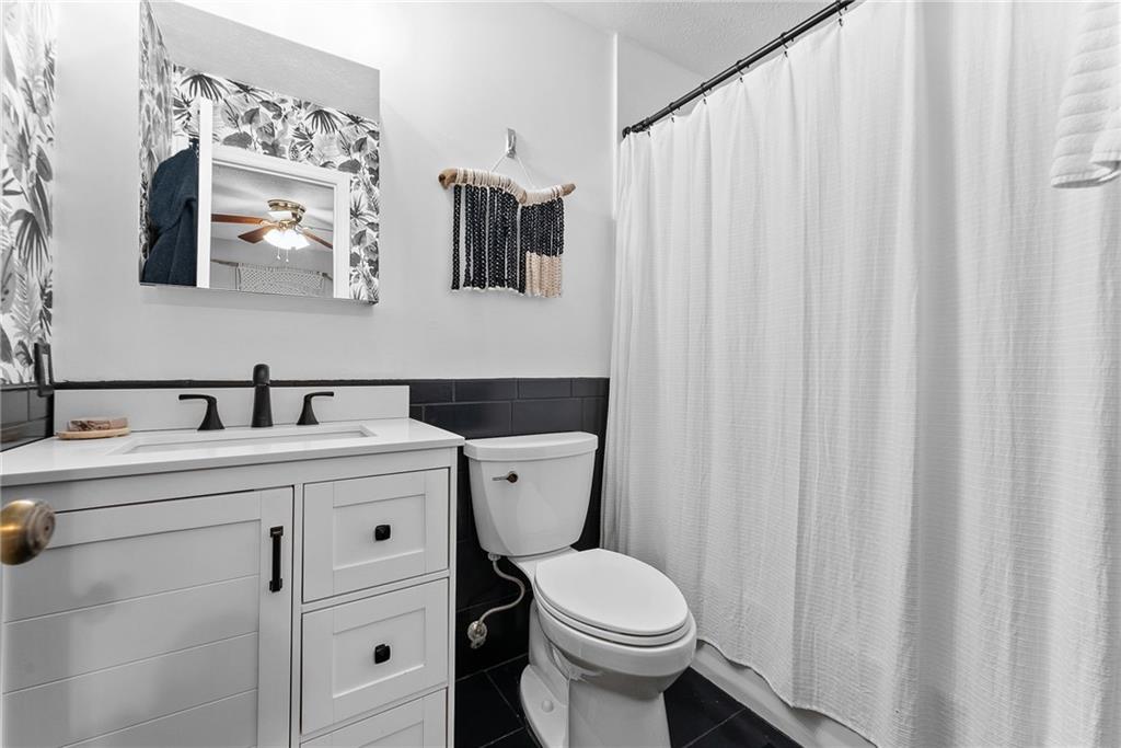 1163 Valleyview Drive Lawrence, PA 15055 - Photo 13 of 25 a bathroom with a toilet sink and mirror