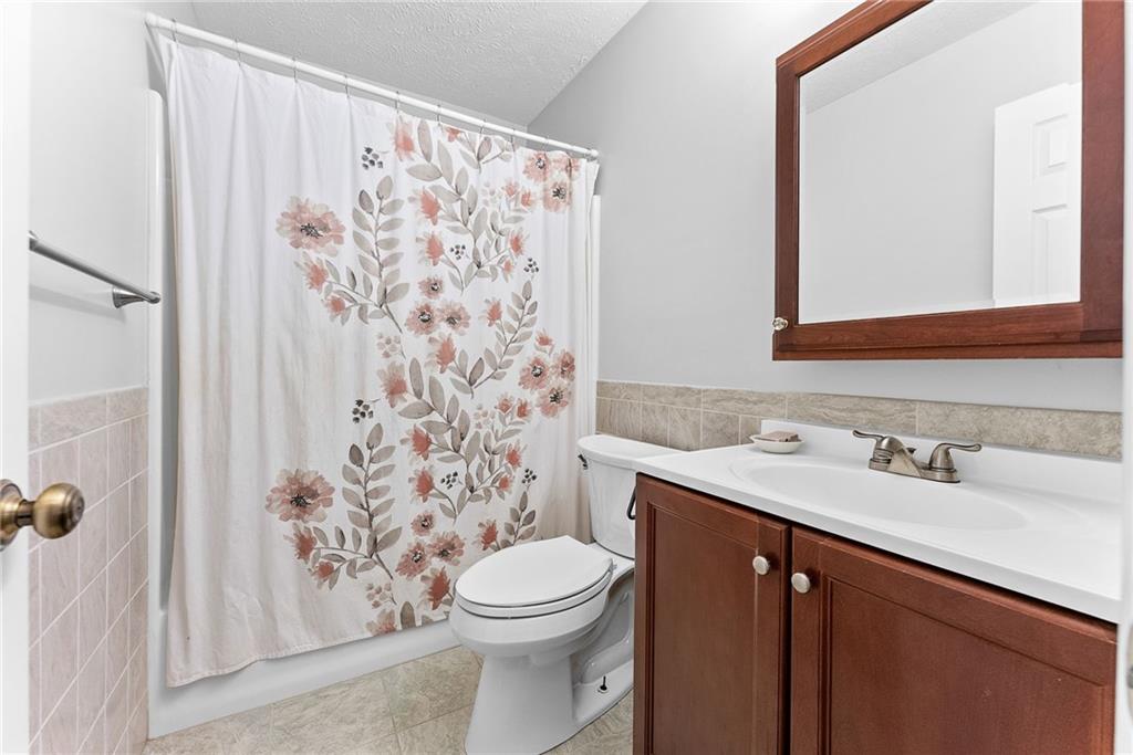 1163 Valleyview Drive Lawrence, PA 15055 - Photo 18 of 25 a bathroom with a sink and a mirror