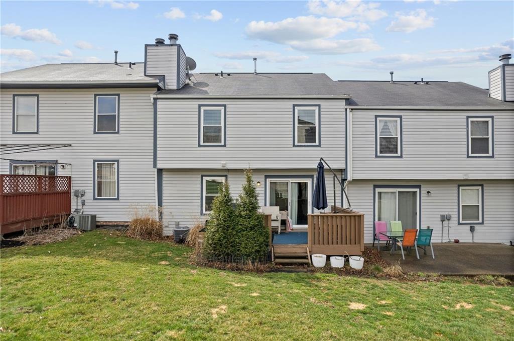 1163 Valleyview Drive Lawrence, PA 15055 - Photo 21 of 25 a view of a house with a patio and a yard