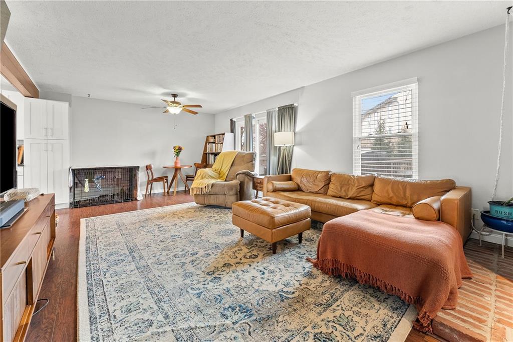 1163 Valleyview Drive Lawrence, PA 15055 - Photo 3 of 25 a living room with furniture and a flat screen tv