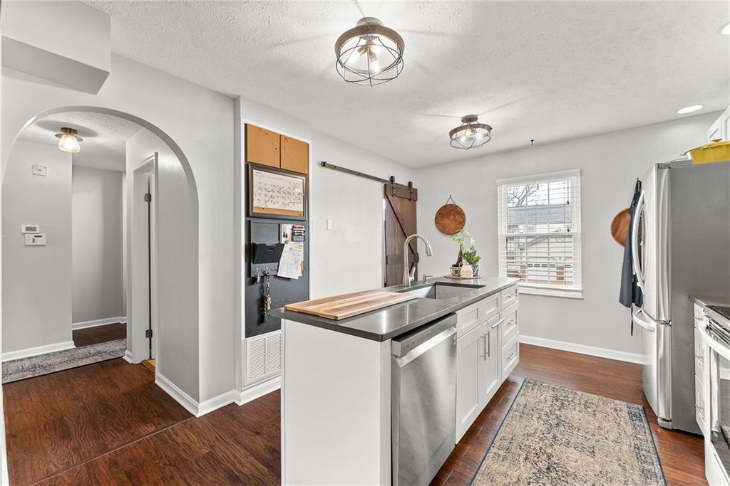 1163 Valleyview Drive Lawrence, PA 15055 - Photo 7 of 25 a kitchen with stainless steel appliances granite countertop a refrigerator and a stove