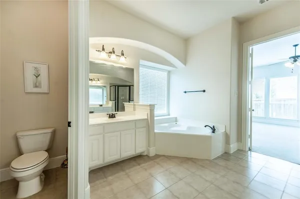 a bathroom with a sink a toilet and bathtub