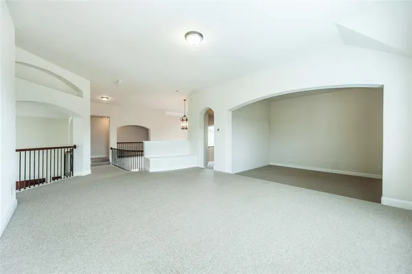 a view of empty room with stairs