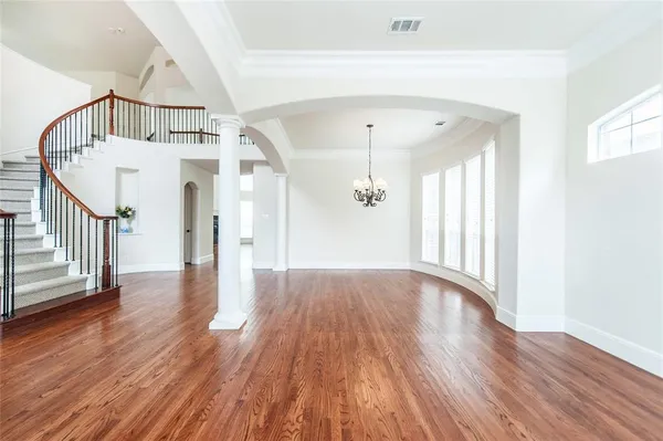 a view of an entryway with wooden floor