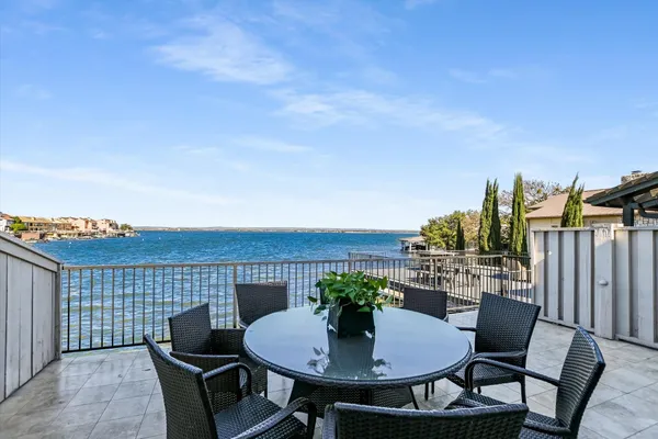 a backyard of a house with table and chairs