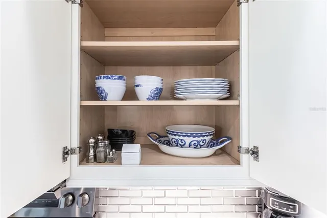 a table with a vase and a vase of flowers on it