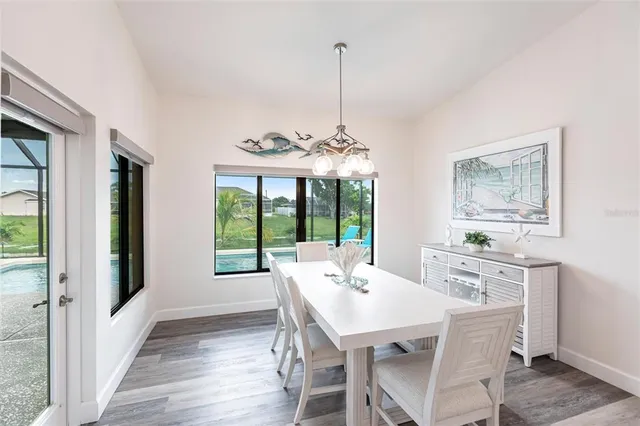 a view of a dining room with furniture window and outside view