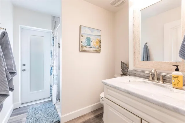 a bedroom with two beds and a chandelier