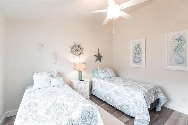 a en suite bathroom with a granite countertop sink and a mirror