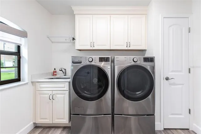 a living room with furniture and a ceiling fan