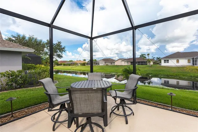 an aerial view of a house with garden space and street view