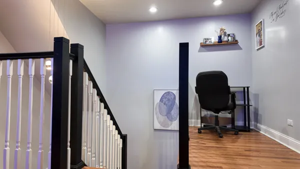 a view of entryway livingroom and hall with wooden floor