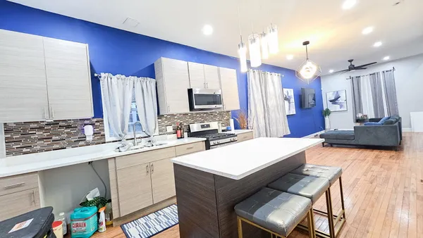 a kitchen with a sink appliances and cabinets