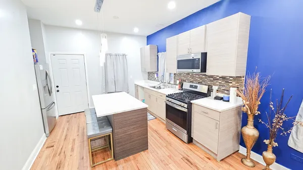 a kitchen with a sink stove and refrigerator