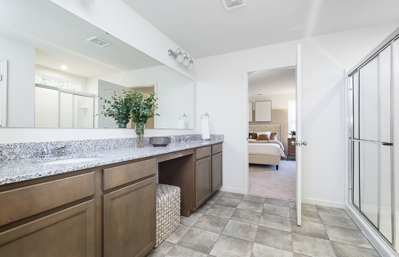 918 Houston Street Batavia, IL 60510 - Photo 20 of 20 a spacious bathroom with a granite countertop sink and a mirror