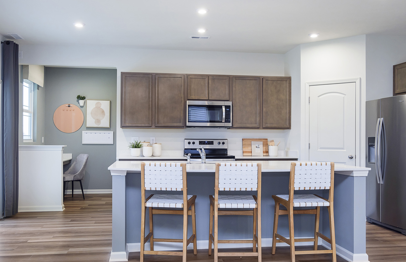 918 Houston Street Batavia, IL 60510 - Photo 2 of 20 a kitchen with a table chairs refrigerator and microwave