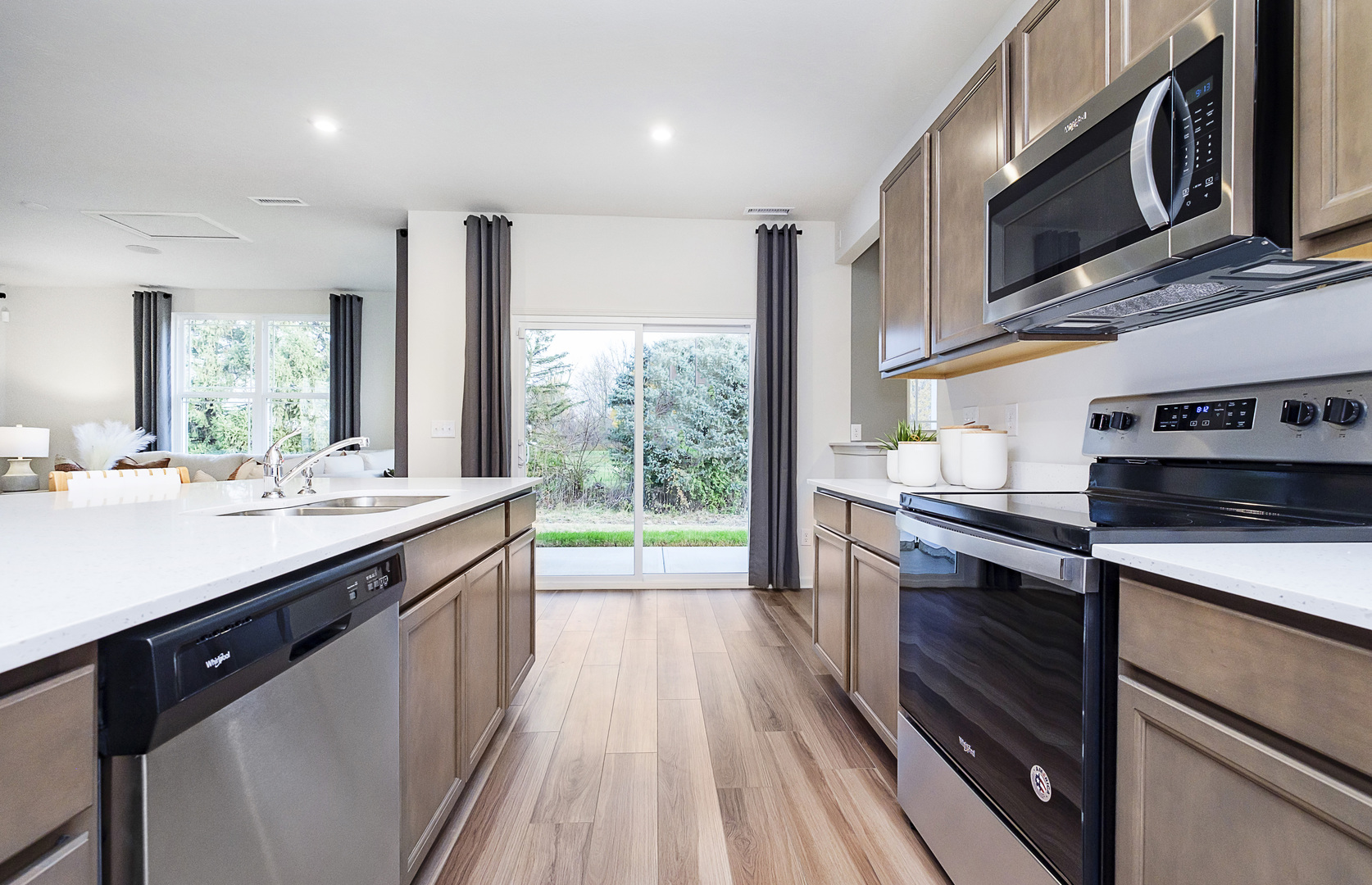 918 Houston Street Batavia, IL 60510 - Photo 6 of 20 a kitchen with stainless steel appliances granite countertop a sink a stove and a wooden floors