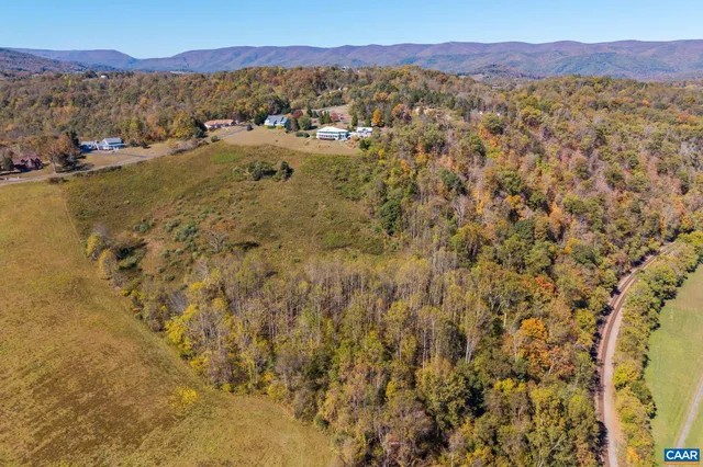 a view of a house with wooden fence