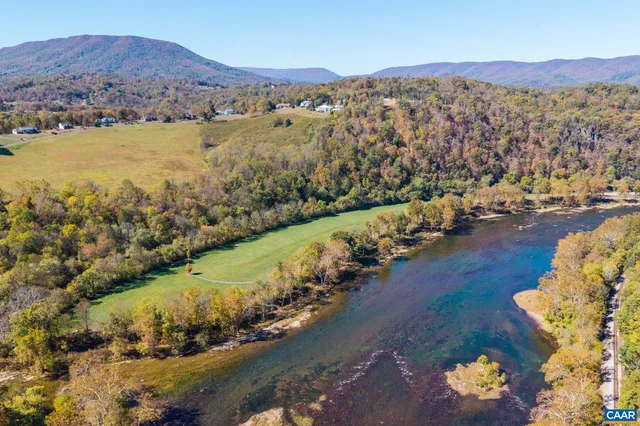 a view of a dining room with furniture wooden floor and chandelier