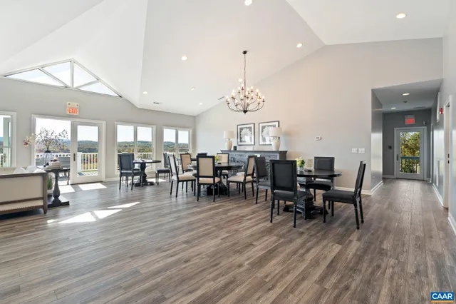 a bedroom with a balcony a bed and a table