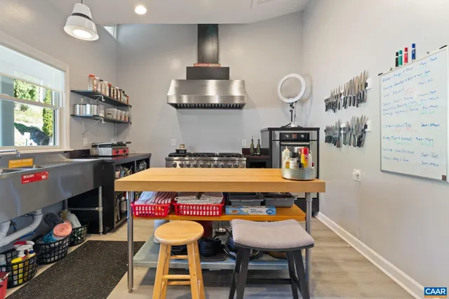 a view of a balcony with wooden floor and outdoor seating