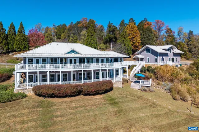 a view of a house with outdoor space and sitting area
