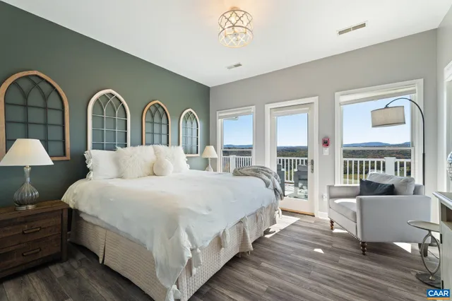 a bedroom with a bed and a table