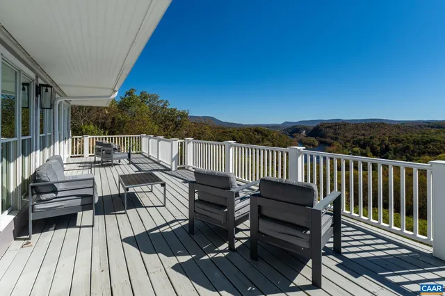 a bedroom with a bed and wall painting