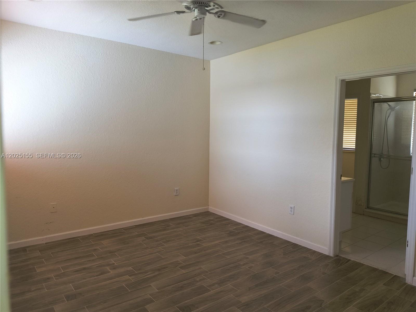 1645 Southeast 20th Road, Unit 1645 Homestead, FL 33035 - Photo 12 of 20 wooden floor in an empty room