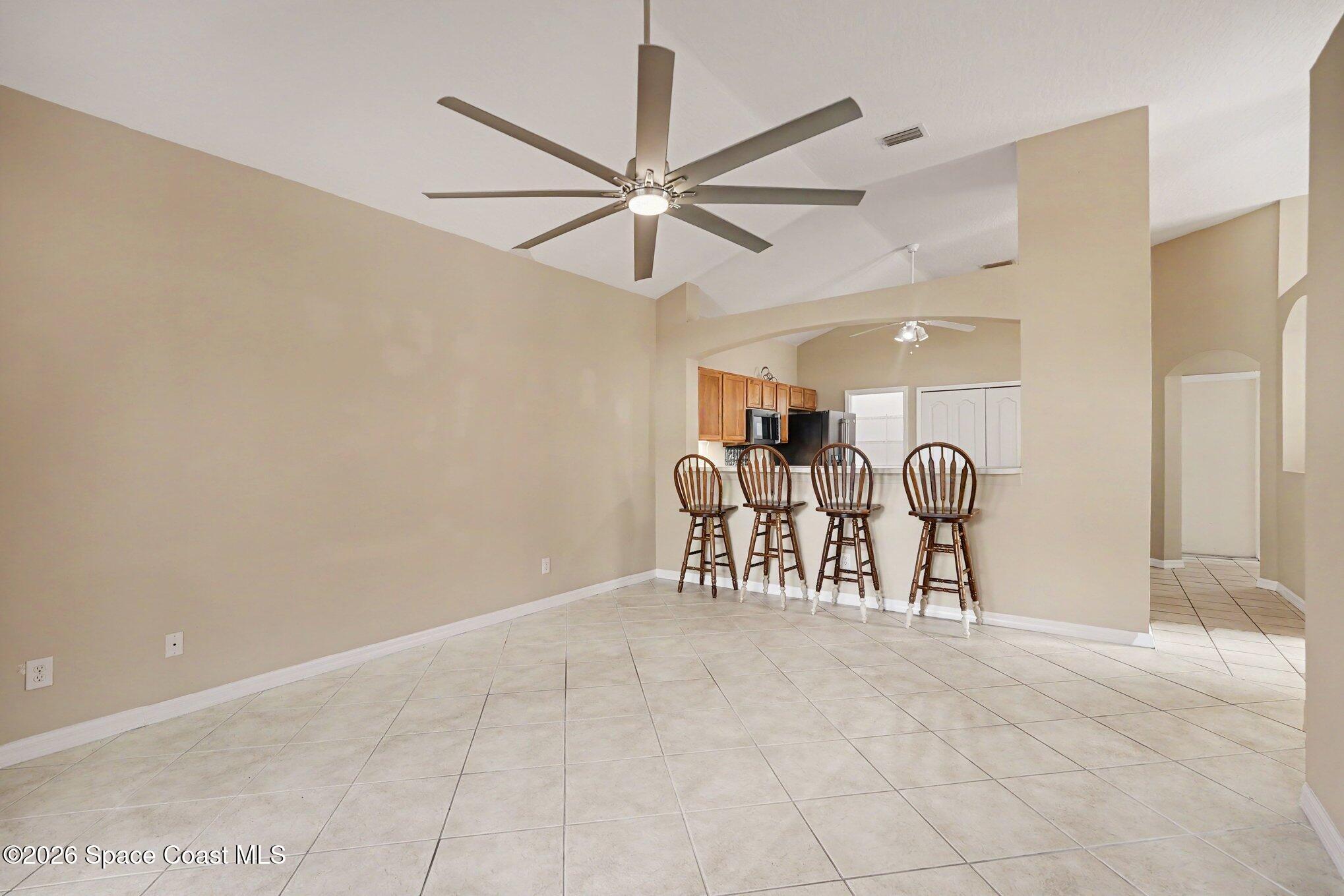 284 Intrepid Way Indialantic, FL 32903 - Photo 14 of 36 a view of a livingroom with furniture and a ceiling fan