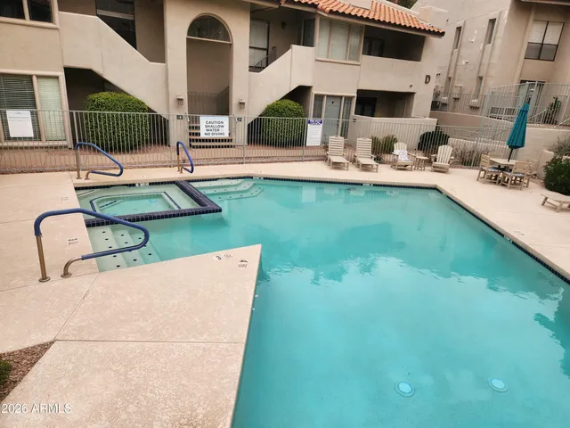 a view of pool with patio