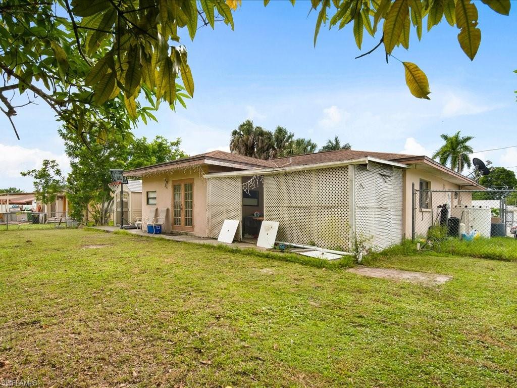 4865 22nd Avenue Southwest Naples, FL 34116 - Photo 17 of 20 a view of a house with a yard
